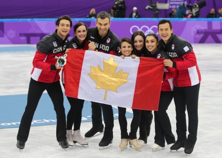 Canada's figure skaters celebrate their gold medal victory in the Team Event. (Photo: Greg Kolz)